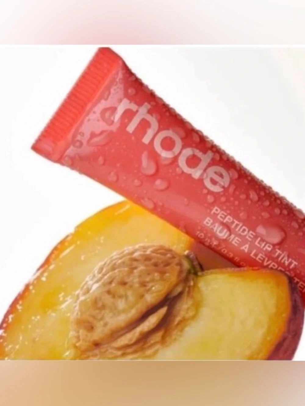 🍑RHODE “Limited Edition” Sheer Peptide Lip Tint In “Peach Pit”
